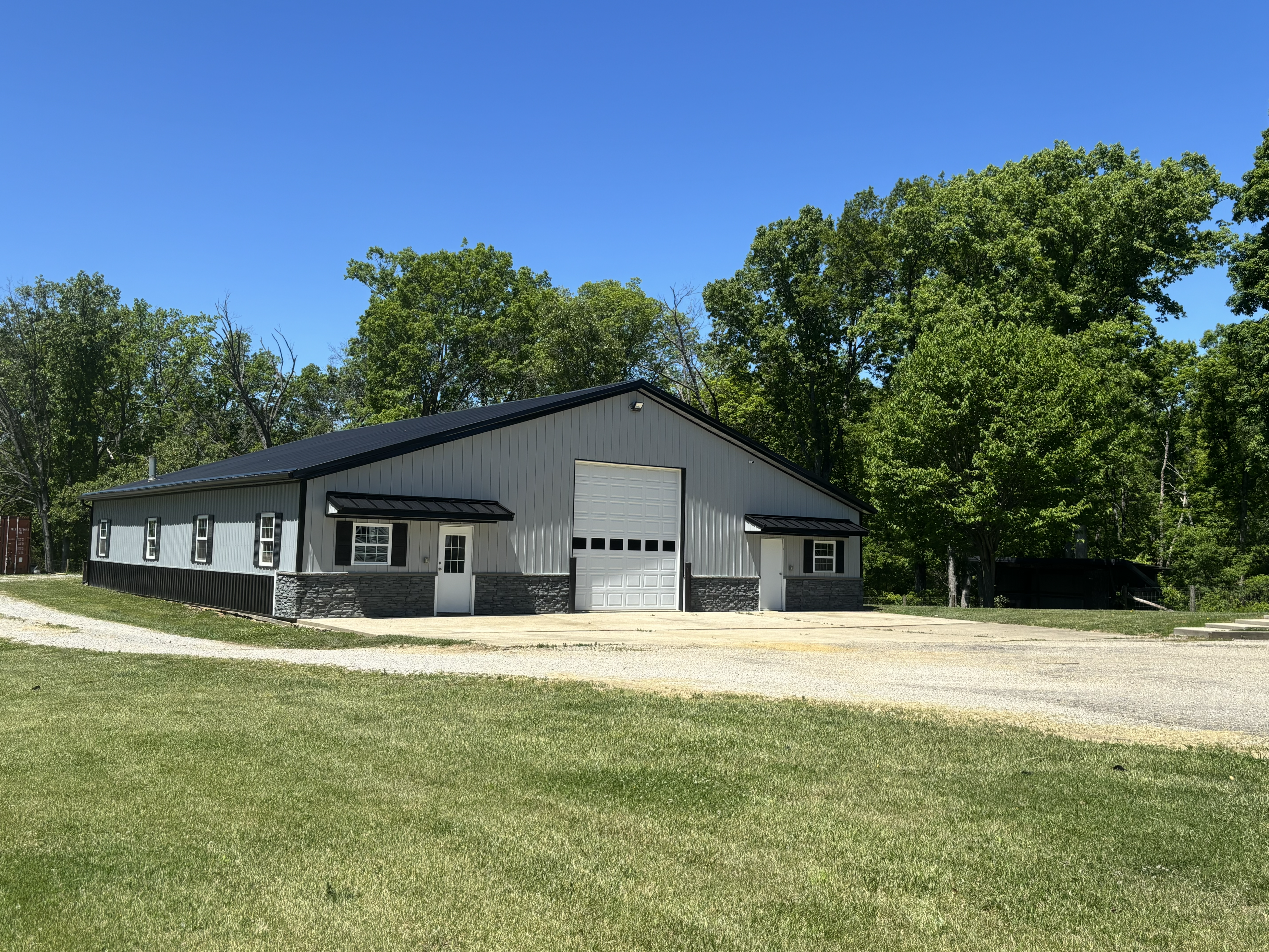 Rural metal building with large garage door