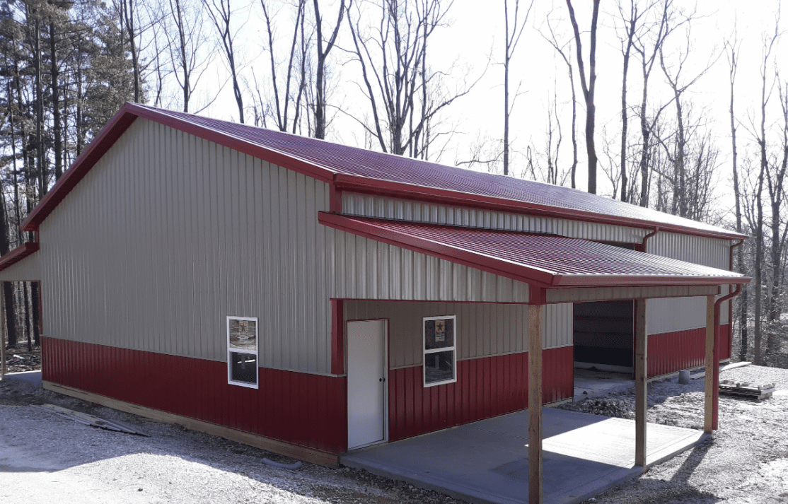 Red and beige metal workshop with lean-to
