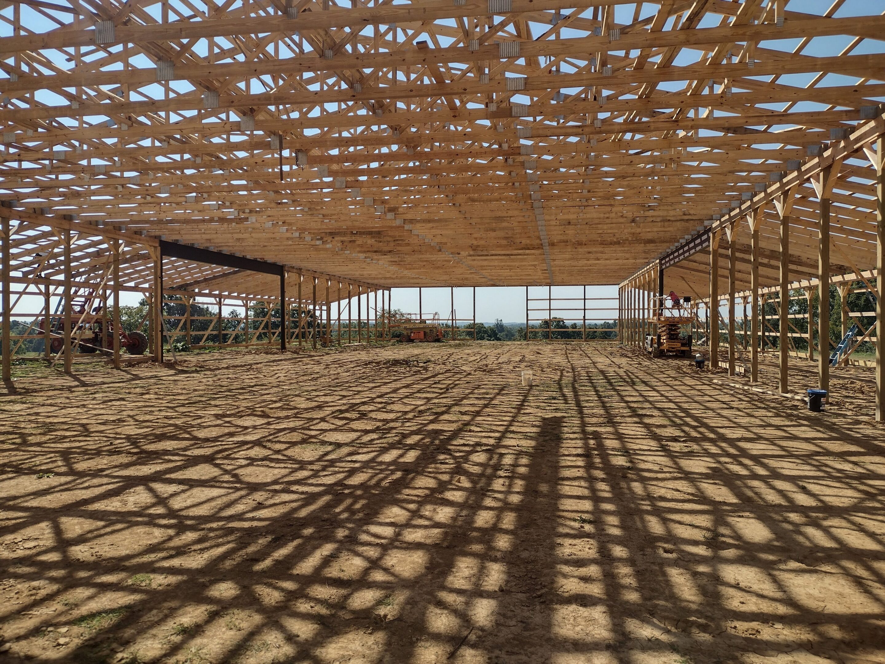 Interior of large wooden barn under construction