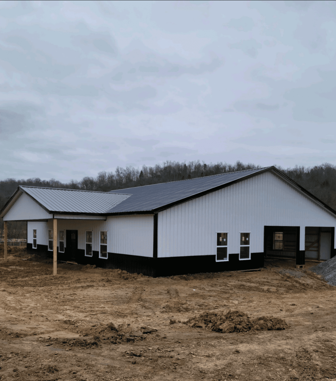 New white metal building on muddy lot