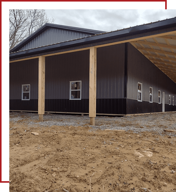 Modern black metal barn under construction